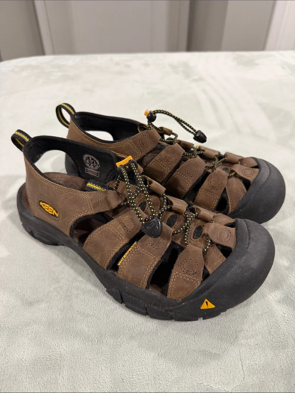 KEEN Brown and Black Men’s Closed-Toe Sandals with Yellow Accents. Never worn.